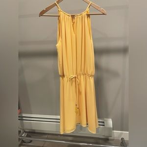 Strappy White House Black Market yellow dress: polyester with soft, sheer lining
